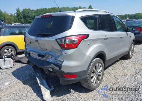 2017 Ford Escape Titanium z USA, uszkodzony, nr VIN 1FMCU9J99HUE88836